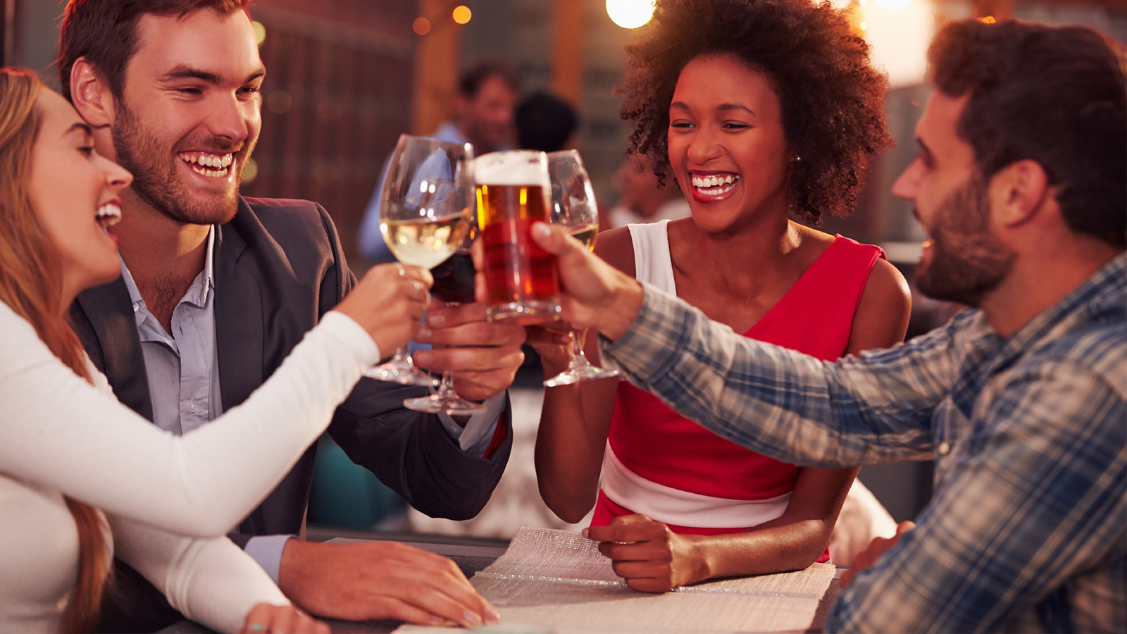 A group toasting beer and wine together